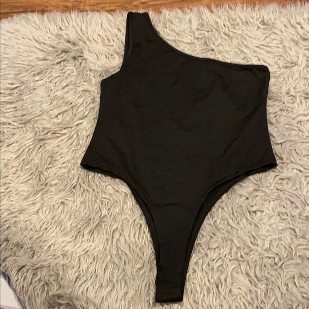 Black one shoulder body suit